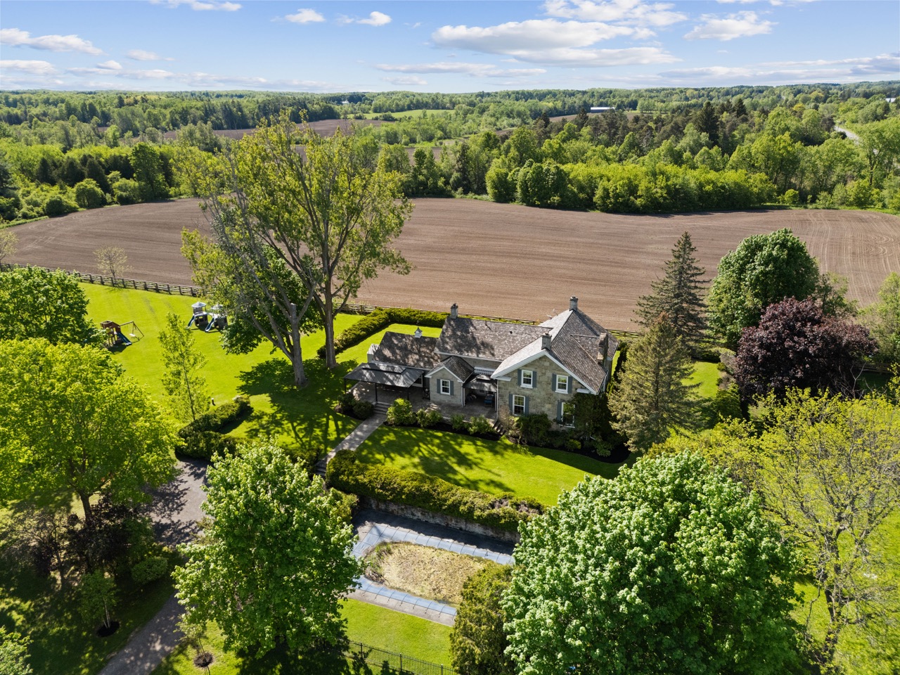 Dunvegan Farm and its surrounding countryside from above